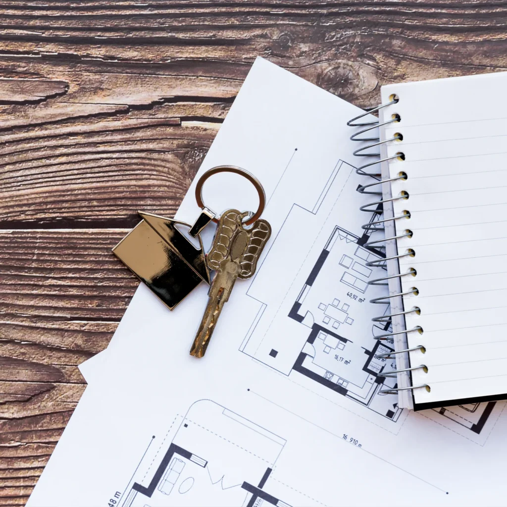 House keys on home plans illustrate equity planning and the Arizona homestead exemption bankruptcy process.